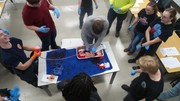 Stop the Bleed Training - Students using gauze with fake blood being pushed through to simulate the process.